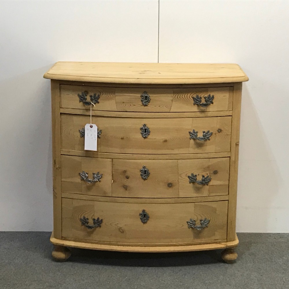 BOW FRONTED ANTIQUE PINE CHEST OF DRAWERS