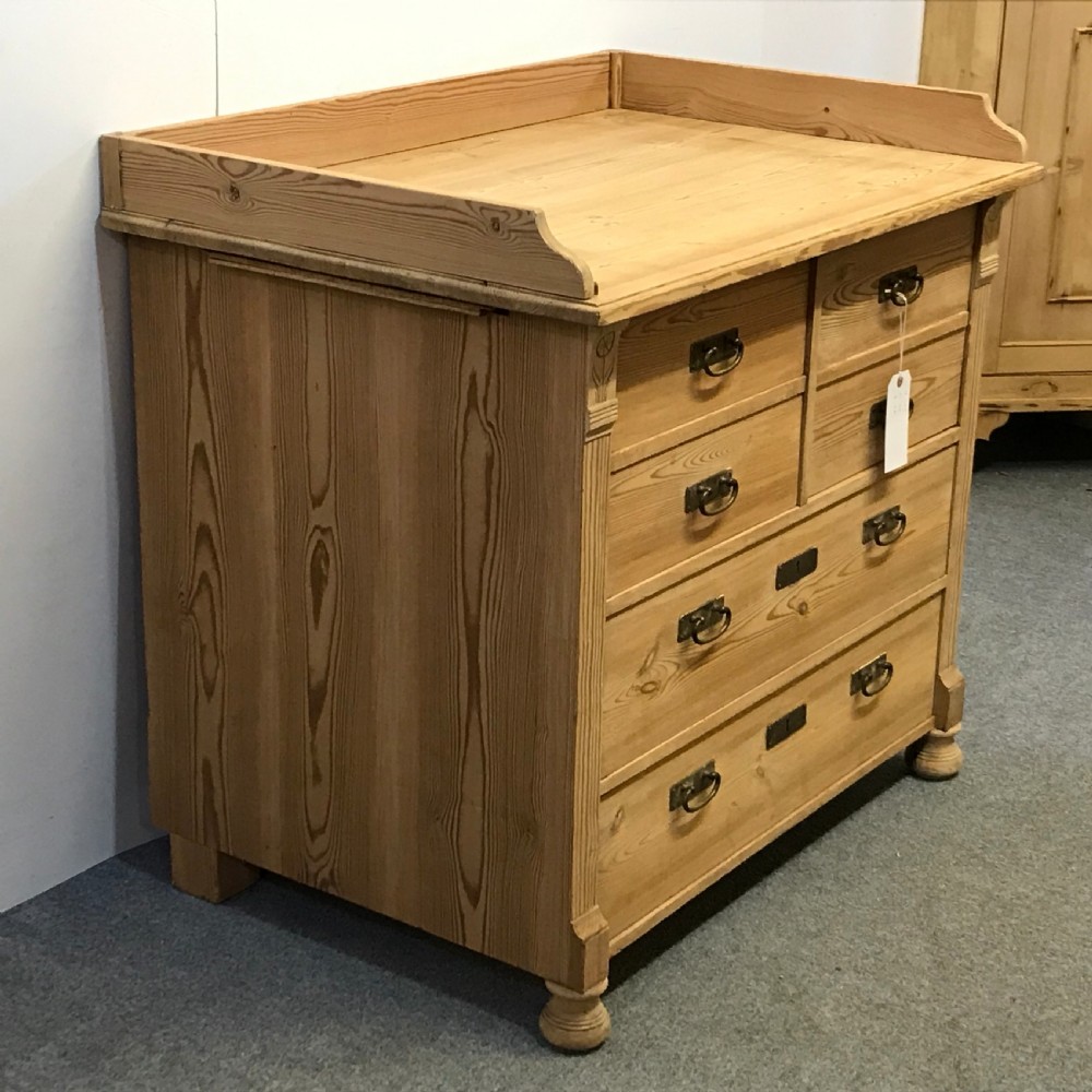 ANTIQUE PINE BANK OF DRAWERS WITH CUPBOARD View II