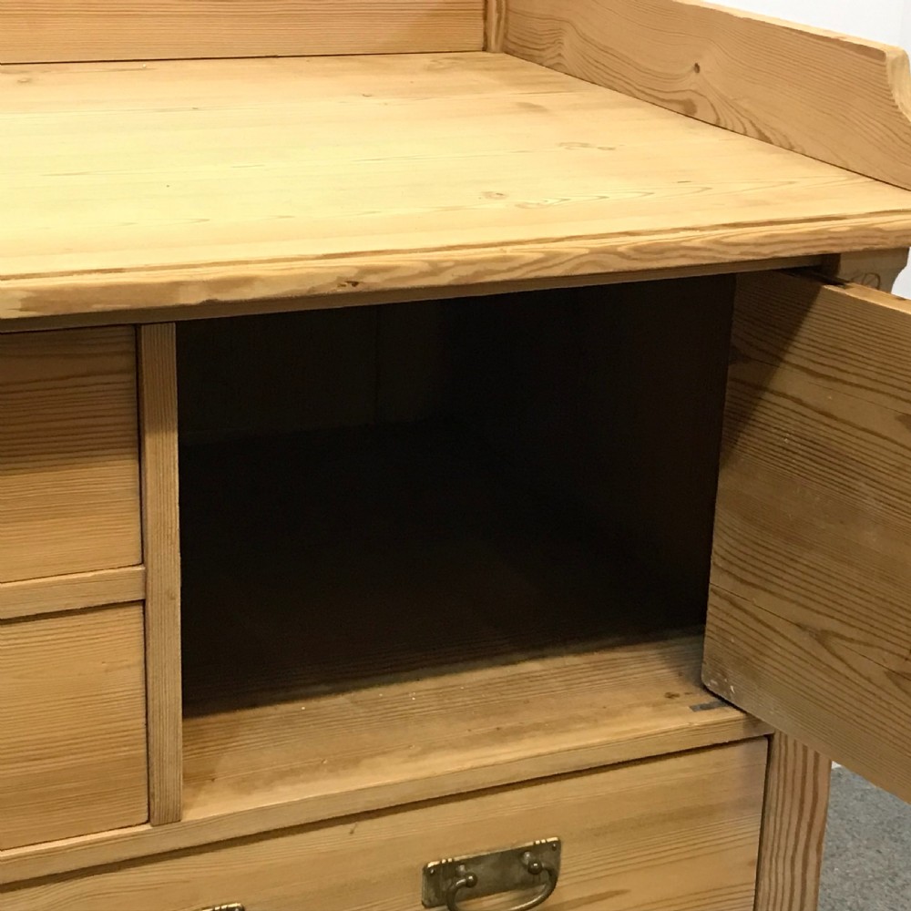 ANTIQUE PINE BANK OF DRAWERS WITH CUPBOARD View V