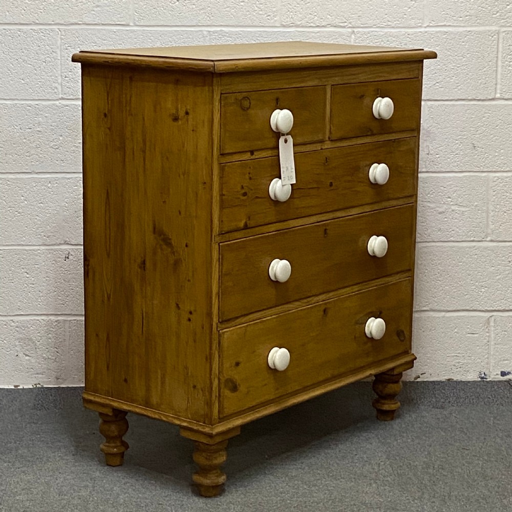 A WAXED ENGLISH VICTORIAN PINE CHEST OF DRAWERS View II