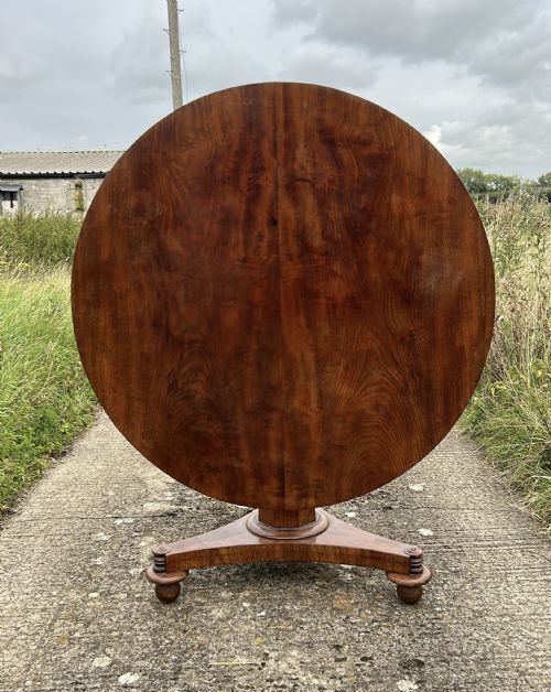 19th Century Mahogany Looe Table/ Tilt Top Table/Center Table.

Solid table with quality top. At some point has had its bun feet or castors replaced as shown in last photo.
