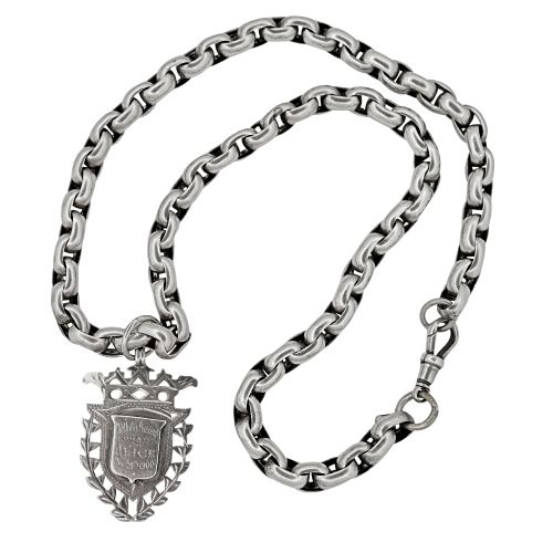 fig 1. A heavy Victorian sterling silver belcher link chain necklace featuring a dog clip clasp and an engraved shield pendant.