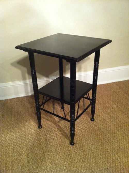 A Victorian Ebonised Aesthetic Movement Two Tier Table Designed by E W Godwin C1880. 
