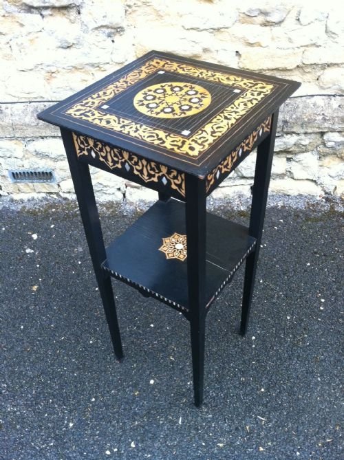 An Unusual Arts & Crafts Ebonised Ebony, Boxwood and Mother of Pearl Inlaid Two Tier Table C1895.