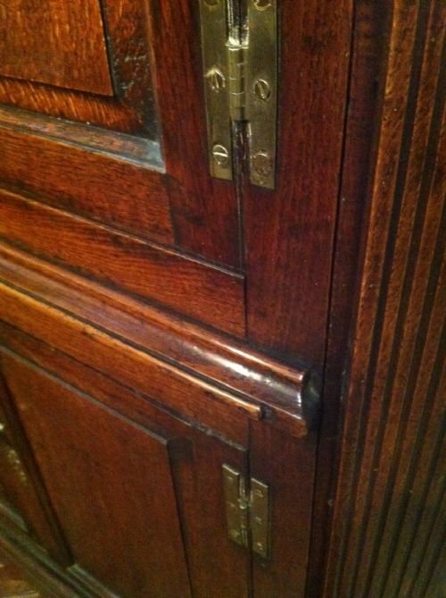 fig 1. A George 111 oak architectural satnding corner cupboard c 1780