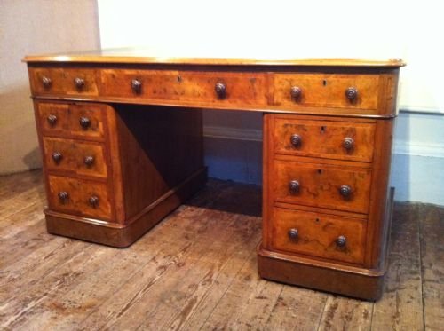 fig 1. A Victorian burr walnut and tulipwood crossbanded pedestal desk c 1860