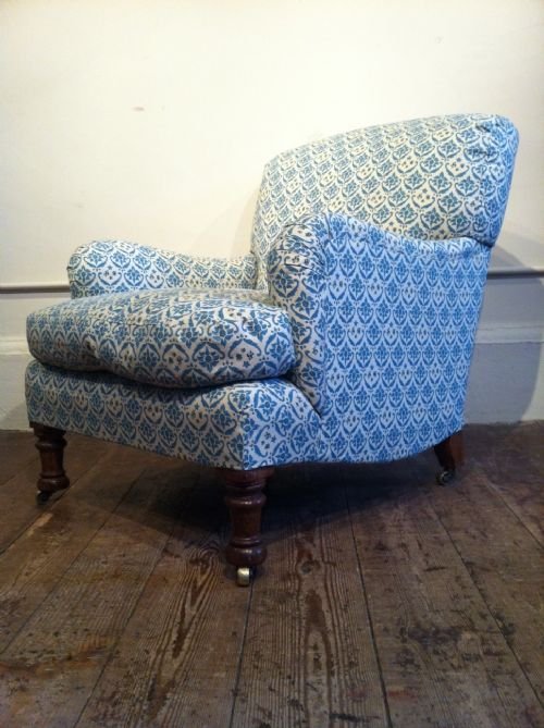 fig 1. A late Victorian Howard and Sons Bridgewater armchair c 1890 on gun barrelled column front legs.