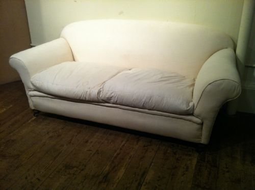 A Late Victorian 2 Seater Country House Sofa C1900 with Down and Feather Cushions on Turned Mahogany Legs  
