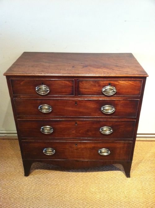 A Small Regency Mahogany Chest C 1810 of Two Short and Three Long Drawers on Splayed Bracket Feet. 

