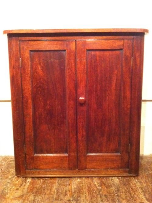 A Victorian Mahogany 2 Door Side Cabinet C 1870 with Bowed Sides and a Shelved Interior . 

