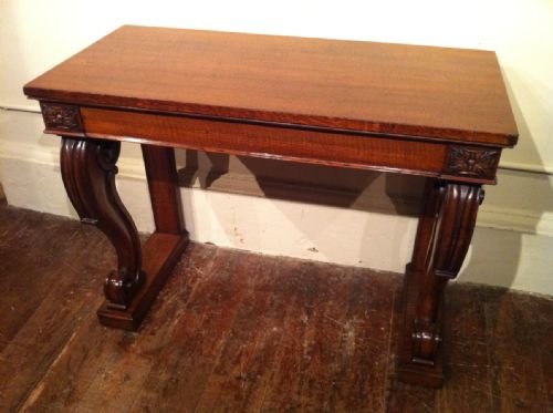 A William IV Oak Console Table C 1835 with a Single Frieze Drawer on Scrolled Legs and a Platform Base. 

42 Ins W 20 Ins D 31.5 Ins H  / 107 Cm W 51 D 80h
