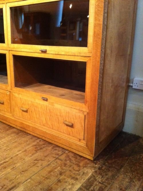 fig 1. An English Art Deco Birds eye maple and plane wood Shop Cabinet made for Gamages of Holborn by Pollards of Clerkenwell c1925