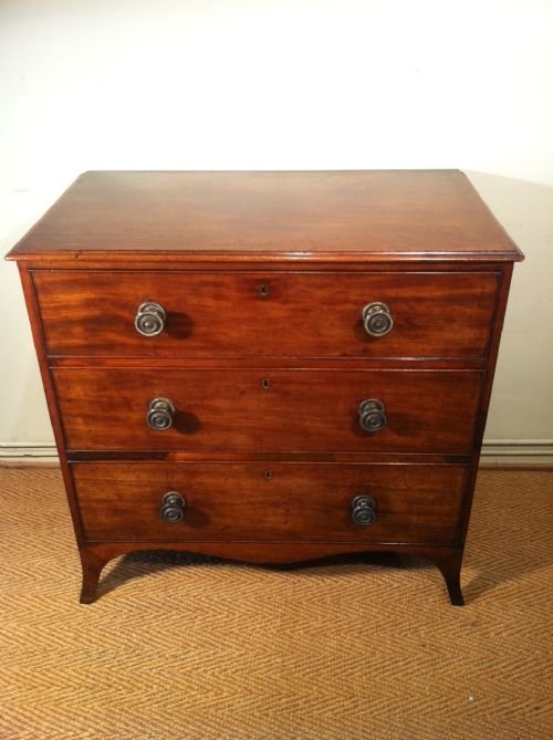 fig 1. A small Regency mahogany chest of 3 long drawers with brass knob handles c 1810