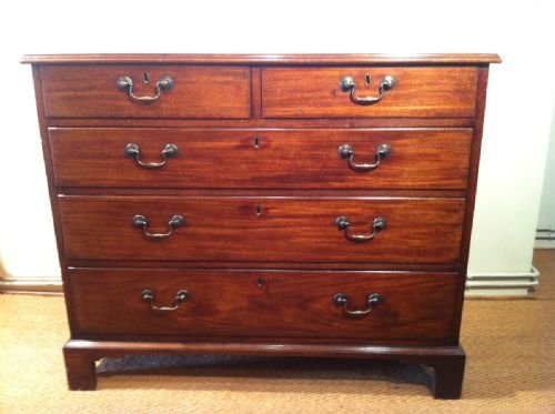 A Chippendale Period George 111 Mahogany Chest of Drawers C 1770 with Original Brass Swan Neck Handles on Bracket Feet.

