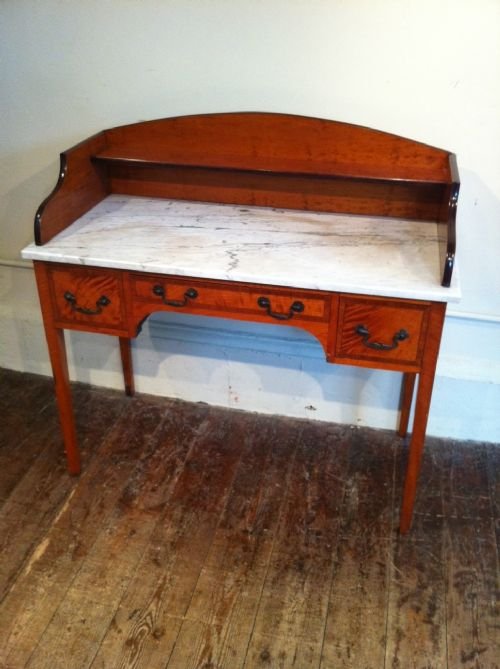 fig 1. A Victorian satinwood and tulipwood crossbanded marble top washstand or dressing table c 1880