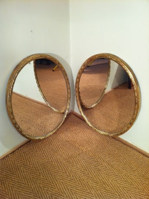 A Pair of Victorian Oval Mirrors with Carved Ribbon Decoration to the Border C1880