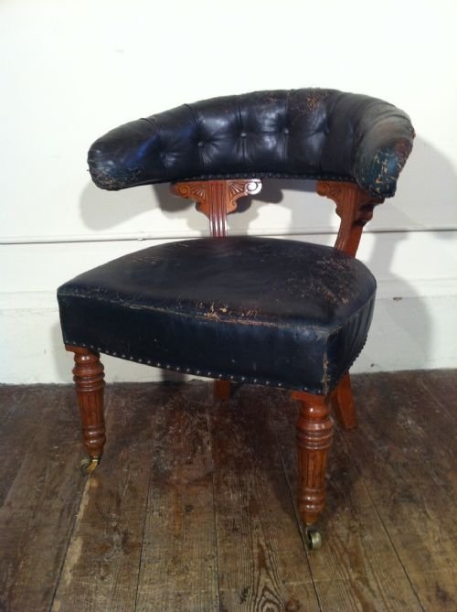 A Victorian Oak Desk Chair C 1880 Covered in the Original Green Morocco Leather 
