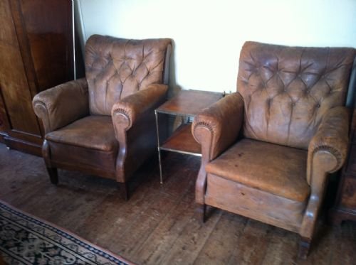 A Pair of French Library Chairs C 1890 Covered in the Original Soft Brown Button Back Leather.
