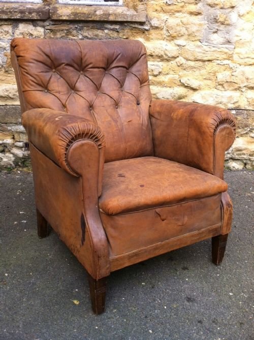 fig 1. A pair of French library chairs c 1890 covered in the original soft brown button back leather.