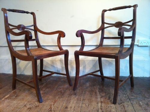 fig 1. A set of 11 Anglo Indian teak dining chairs c 1890 in Regency style with caned seats and squab cushions