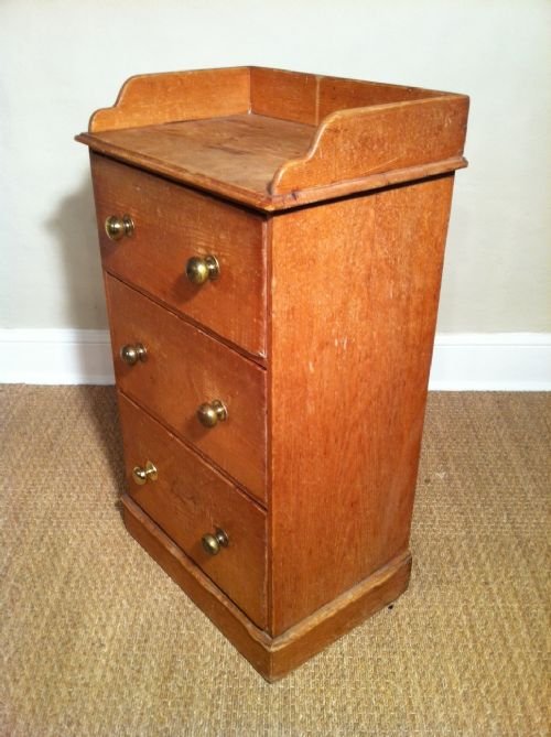 fig 1. A mid 19th century pine three drawer chest of small size