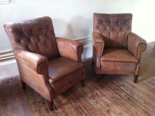 A Pair of Late 19th Century Brown Leather Button Back Library Chairs.