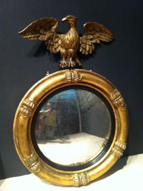 A Large Regency Gilt Convex Mirror with Eagle Surmount C1810