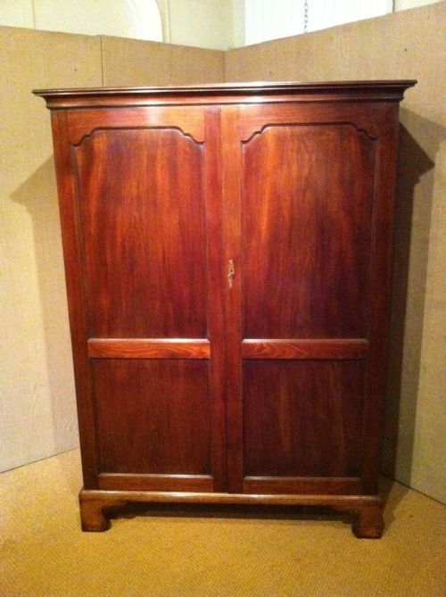 fig 1. A George 111 mahogany panelled fonted wardrobe c 1790