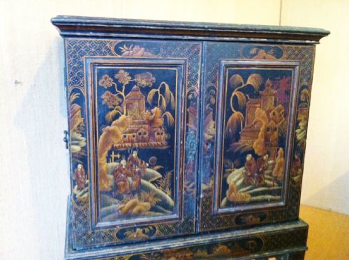 fig 1. A Regency chinoiserie lacquer and gilt cabinet on stand c 1820