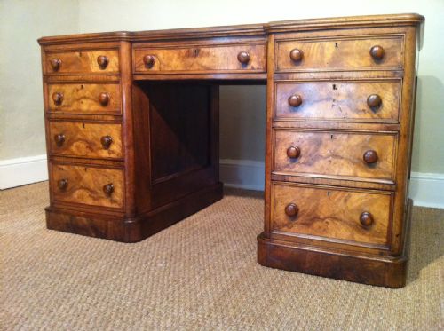fig 1. A Victorian figured walnut freestanding pedestal desk c 1870