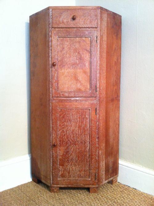 A Heals Oak Corner Cupboard C 1935