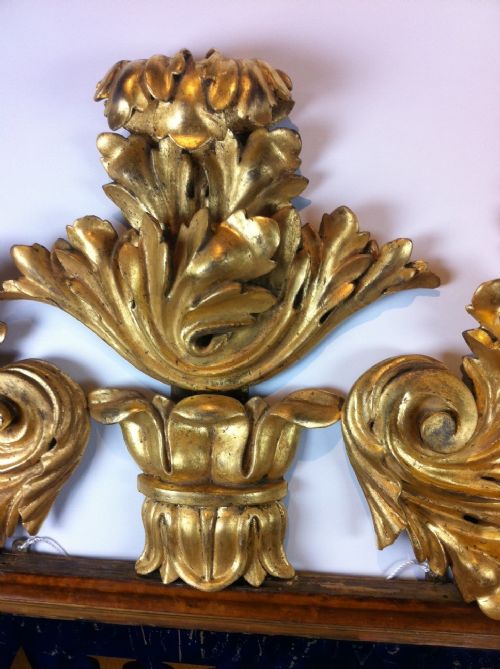 fig 1. A George IV gilt and maple mirror sign c 1825-30