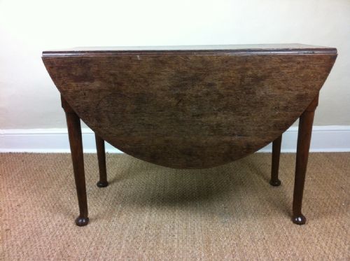 fig 1. A George 111 oak padfoot drop flap table 1760