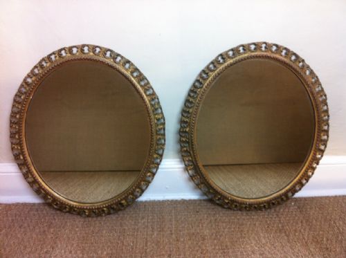 A Pair of Late Victorian Gilt Oval Mirrors C 1890