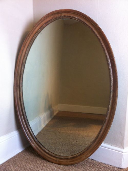 A Georgian Oval Pine Mirror C1820