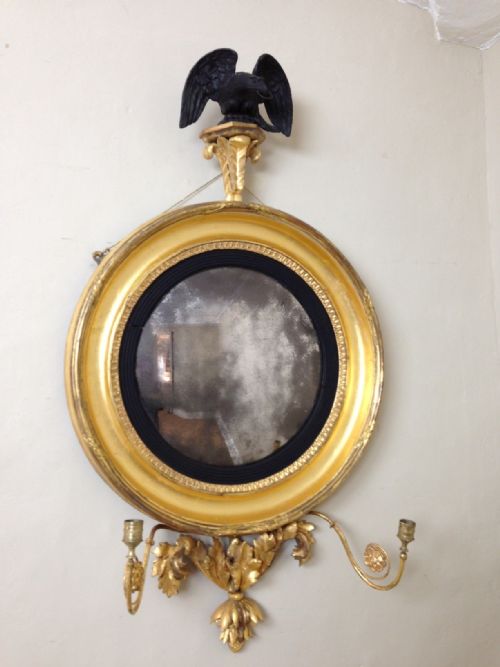 A Regency Gilt and Ebonised Eagle Convex Mirror C 1815