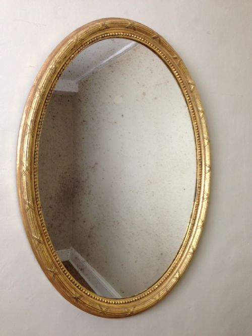 A Victorian Gilt Oval Mirror C 1880