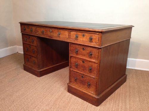 fig 1. A Victorian gothic oak pedestal desk c 1880