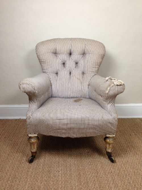 fig 1. An early Victorian parcel gilt library chair c 1840