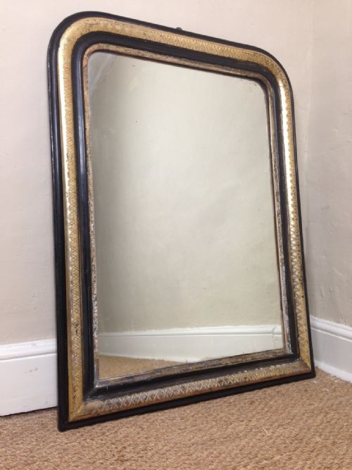 A French Ebonised and Gilt Wall Mirror C 1870