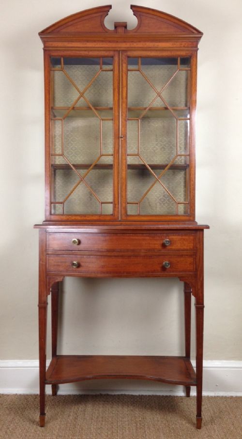 fig 1. An Edwardian satinwood and inlaid display cabinet by Maples c 1910
