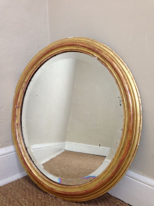A Victorian Oval Gilt Mirror C 1870