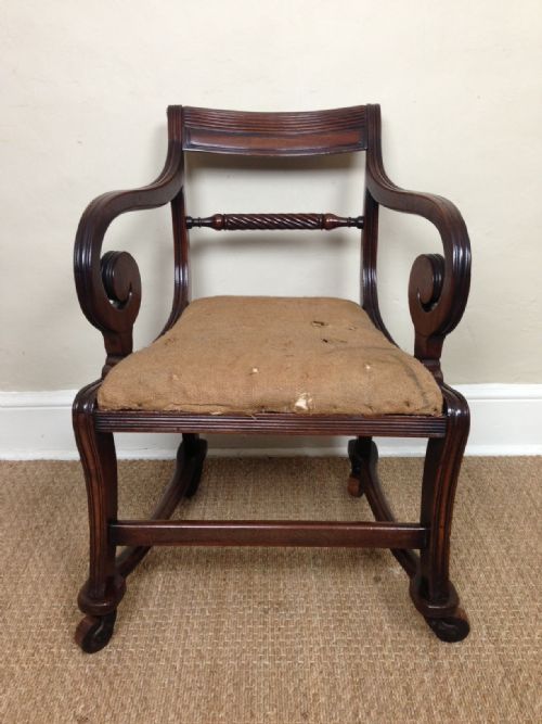 fig 1. A Regency mahogany elbow chair c 1820