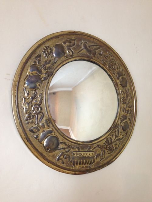 An Arts and Crafts Brass Convex Mirror Dated 1905