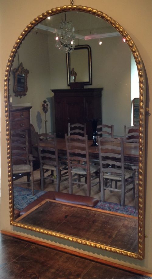 A Large Victorian Arched Gilt Mirror C 1860
