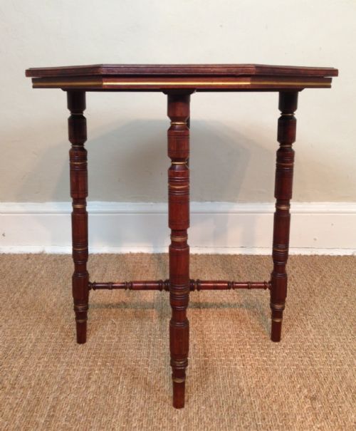 fig 1. A Victorian walnut and parcel gilt octagonal table c 1880