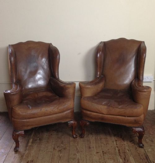 A Pair of Edwardian Walnut and Leather Wing Chairs C 1910