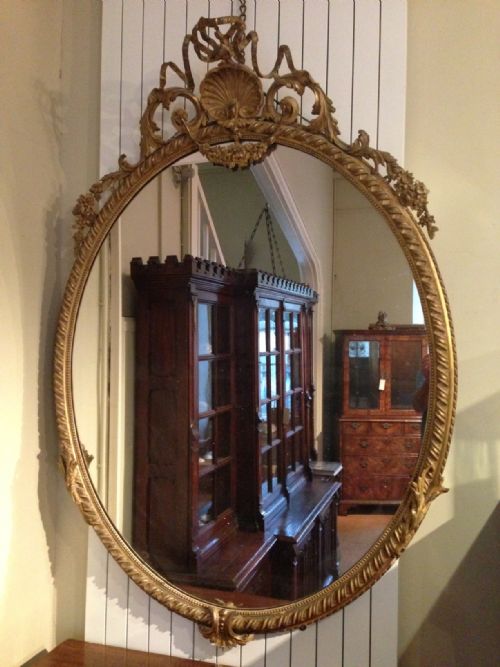A Large Victorian Oval Gilt Wall Mirror C 1870