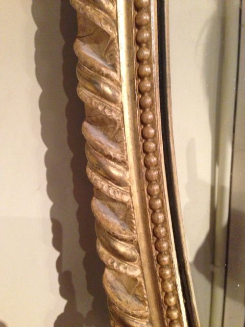 fig 1. A large Victorian oval gilt wall mirror c 1870