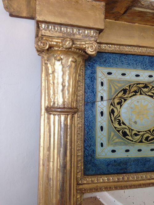 fig 1. A large George 111 gilt and verre eglomise pier mirror c 1810